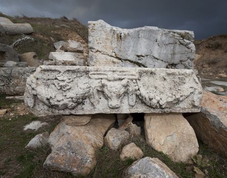 Carved stone piece with ram and graland at Antioch Pisidian in Turkey