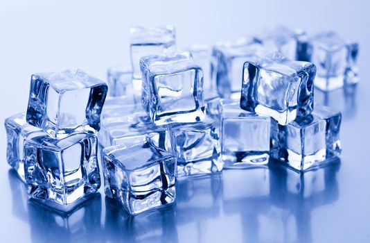 Ice cubes on blue background