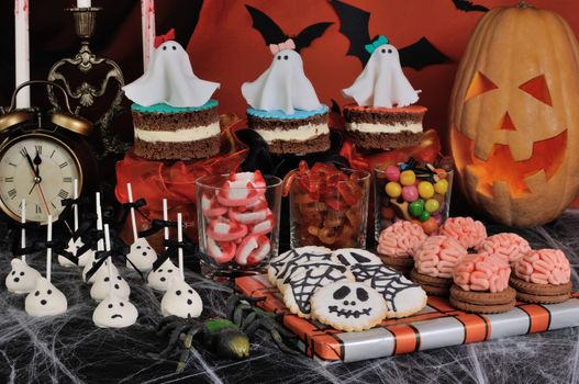 A variety of sweets on the table in honor of Halloween