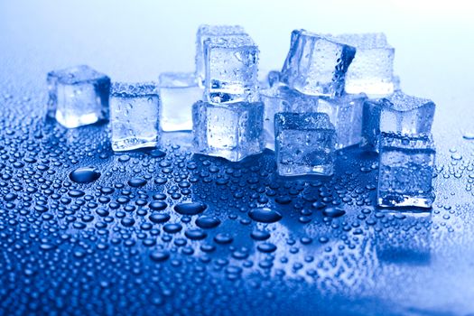 Ice cubes on blue background