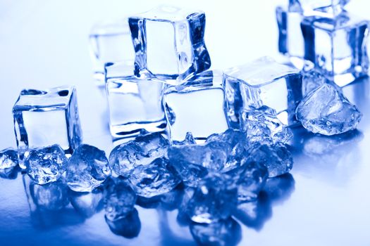 Ice cubes on blue background