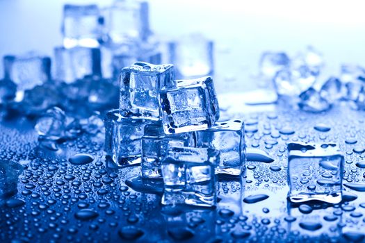 Ice cubes on blue background