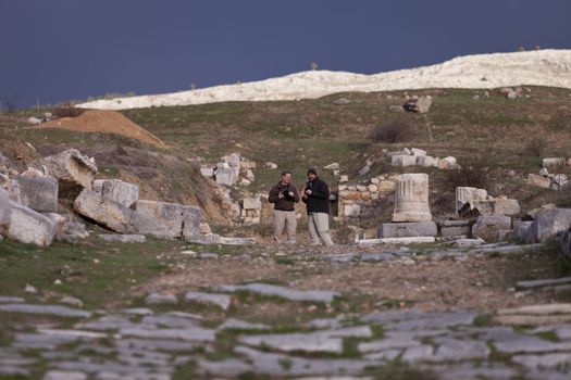 Male American tourists at the ruins of the Antioch Pisidian