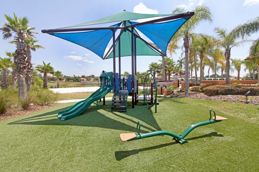 A playground with slides and a seesaw