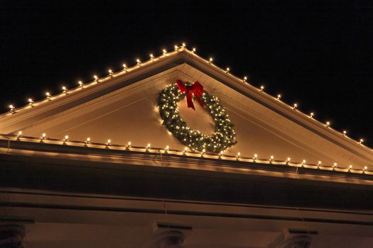 The top of a house with Christmas Lights