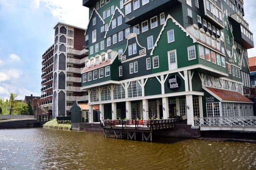 Zaandam, Netherlands - May 5, 2015: Tourist visit Inntel Hotels on May 5, 2015 in Zaandam, Netherlands. Opened in 2009, the design attracts guests by incorporating the traditional architecture of the Zaan region.