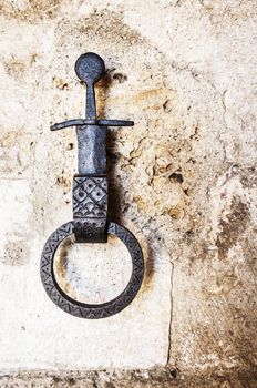 old horse hook on a wall of Siena, Italy
