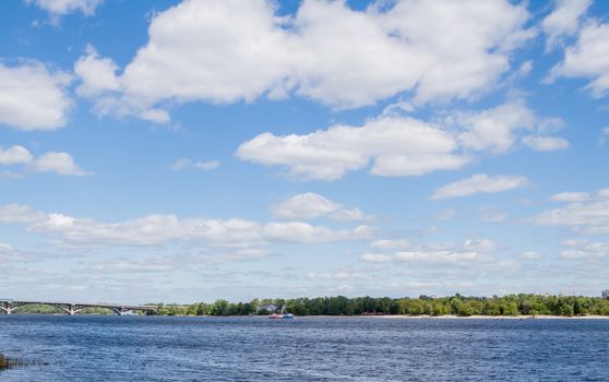 blue cloudy sky over Dnipro river in Kiev Ukraine