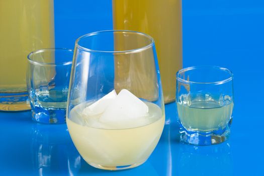 Italian alcoholic drink served in a glass on a light blue background