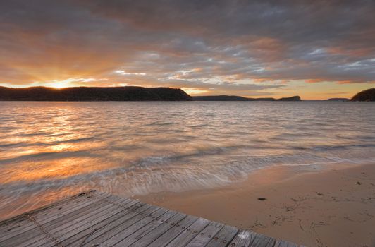 Sunset over Pittwater at Palm Beach from one of the timber boat ramps.