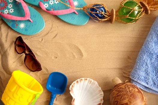 Beach vacation items creating a frame with copyspace in the centre