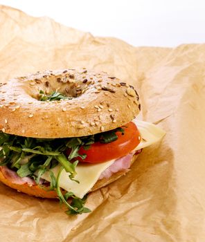 Delicious bagel sandwich on the table