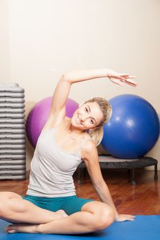 Happy woman making yoga