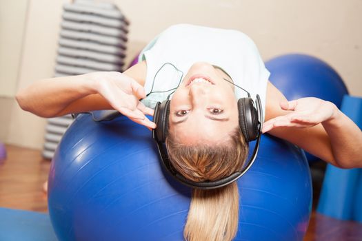 Woman listen to music in yoga class