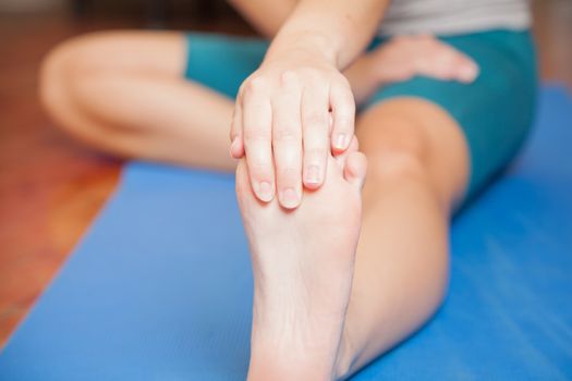 Stretching her foot