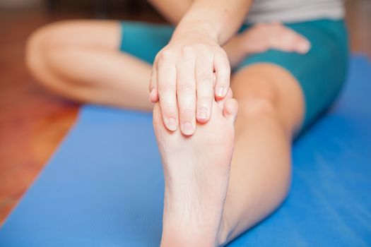 Stretching her foot