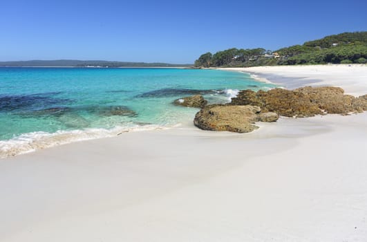 Beautiful crystal clear waters and white sands of Chinamans Beach, Jervis Bay Australia.   With space for copy