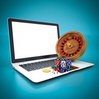 Roulette and casino chips and white laptop on a blue background