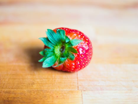 Fresh strawberry on a wooden board