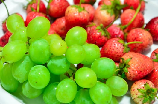 Fresh strawberries and grapes