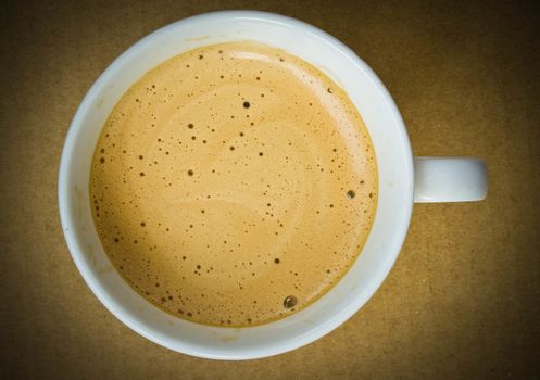 close up of coffee cup on white background