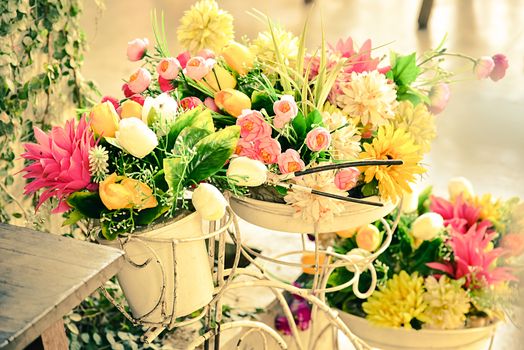 Decoration artificial flower in basket on bicycle