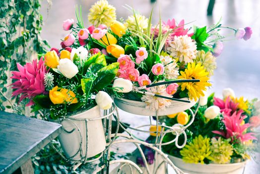 Decoration artificial flower in basket on bicycle