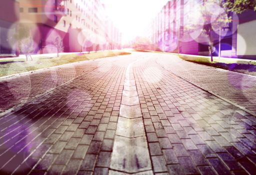 Abstract street floor background.Cobbled floor and sunbeams