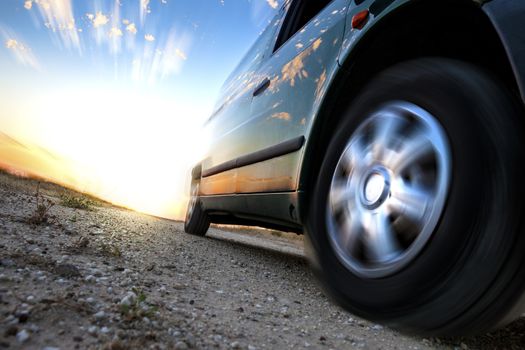 Car and speed. Sunset scenery and fast car outdoor
