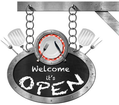 Metallic sign with frame, empty plate, silver cutlery, kitchen utensils and blackboard with text, Welcome it is open. Hanging from a chain and isolated on white