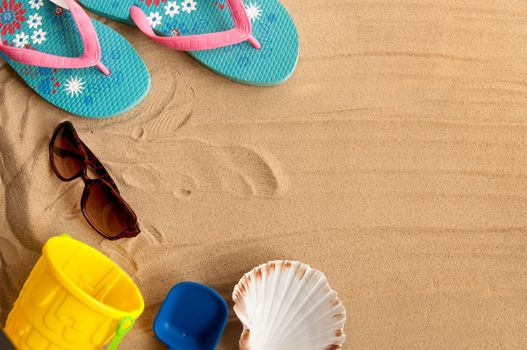 Beach vacation items creating a frame with copyspace in the centre
