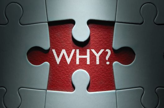 Missing piece from a jigsaw puzzle revealing the question why