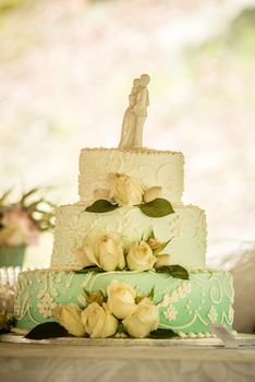 white wedding cake with roses