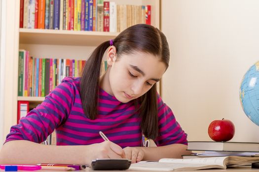 Schoolgirl doing her math homework