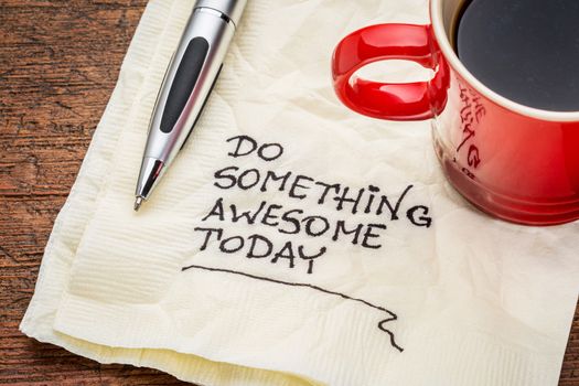 do something awesome today -handwriting on a napkin with a cup of coffee