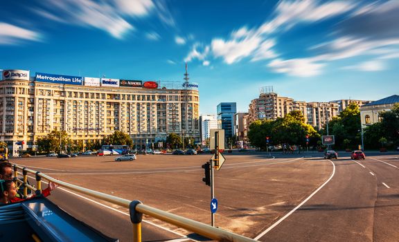 Victoria Square (Piata Victoriei) in Bucharest, Romania seen from convertible city bus.