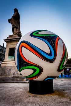 Big football ball and a statue.