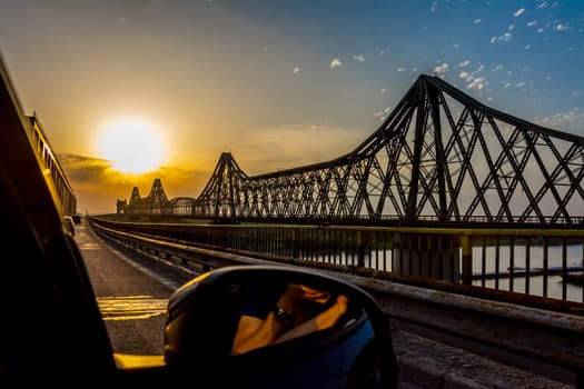 Orange sunset on Anghel Saligny Bridge, Romania.