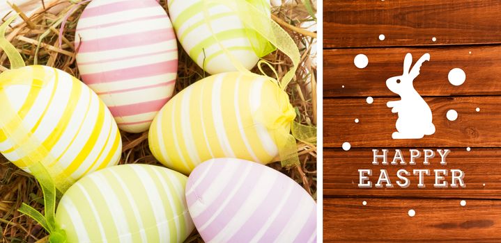 happy easter graphic against overhead of wooden planks