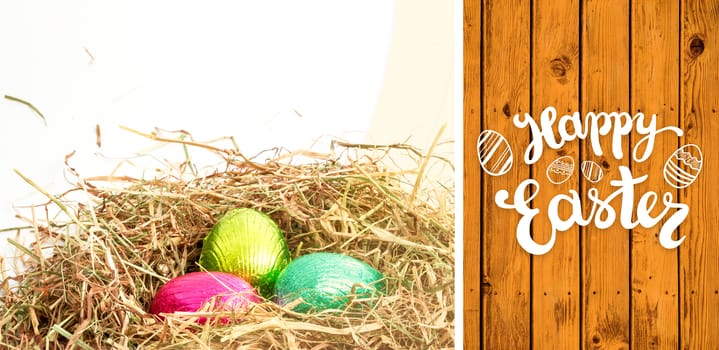 Happy Easter greeting against wooden planks
