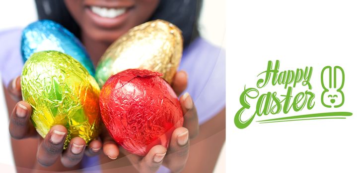 happy easter against close up of a woman showing colorful easter eggs