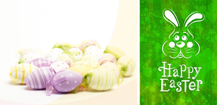 easter bunny with greeting against green paint splashed surface