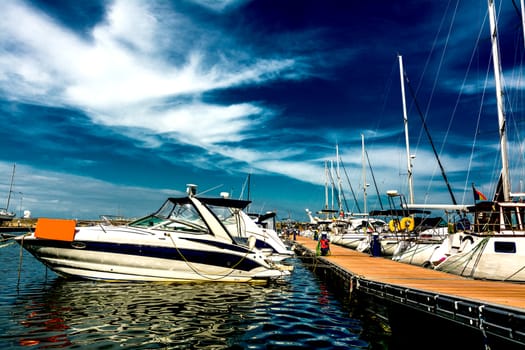 Speed boats and yachts at the marina.