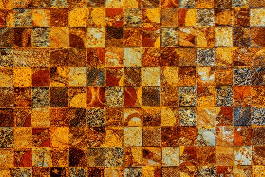 Orange yellow mosaic wall texture.