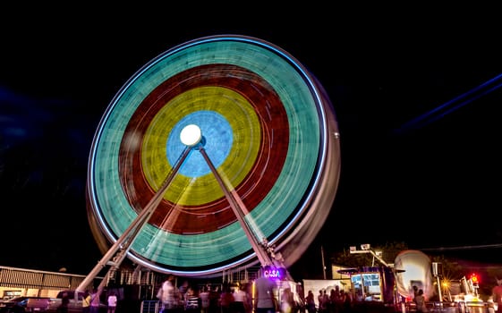 Ferris wheel in motion at night.