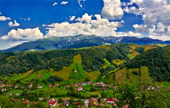 Landscape with Bucegi Mountains and Moeciu Village, Romania.