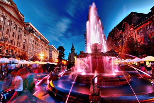 Strong lights on the Fountain with Fish in Timisoara, Romania.