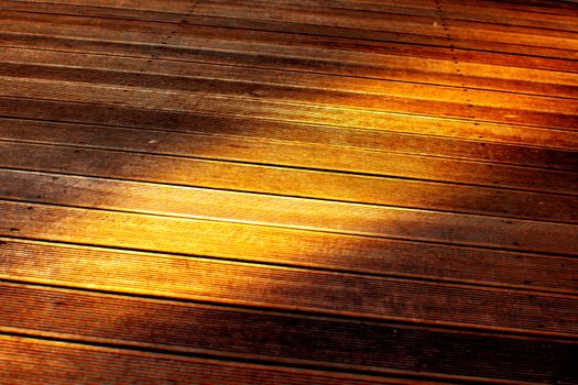 Wooden paving with brown battens texture.