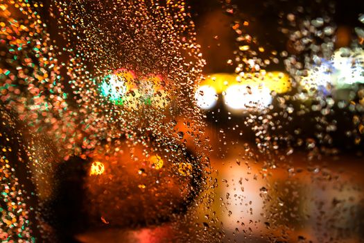 Rainy night through the car window.