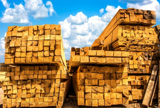 Stacks of yellow sawn timber.